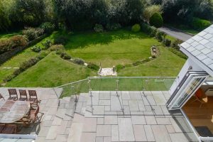 Patio and rear garden at Herongate