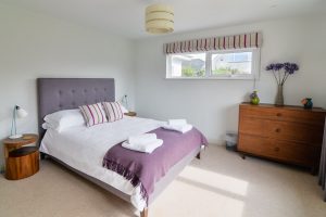 Kingsize bedroom on ground floor at Herongate