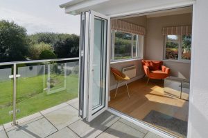 Conservatory at Herongate through bifold doors from the patio
