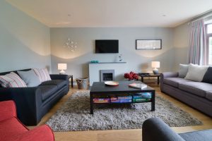 Lounge at High Tides with mounted TV and gas fire