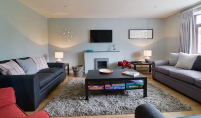 Lounge at High Tides with mounted TV and gas fire