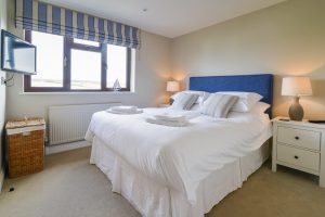 First floor king ensuite bedroom with rural views at High Tides