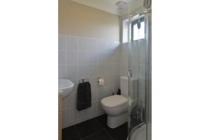 Ensuite bathroom off of Bedroom 1, shower loo and basin