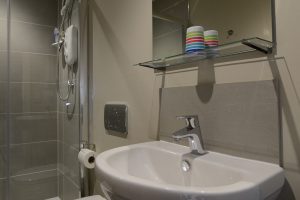 Ensuite shower and toilet from twin bedroom
