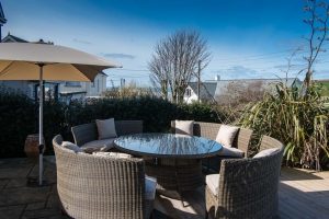 Decking/Patio area with seating an a parasol at High Tides