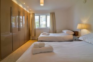 Ground floor twin ensuite bedroom at Highview with ample storage