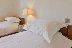 Twin beds in ensuite ground floor bedroom at Highview