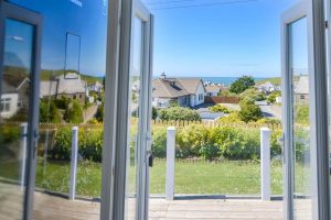 Views from double doors down towards the sea at Highview