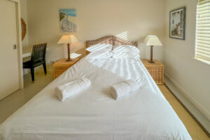 King bedroom at Penamont with bedside tables and lamps