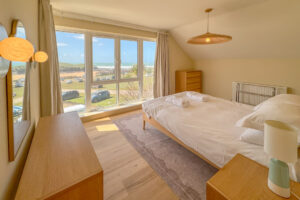 Master King sized bedroom with sea view at Aquataine Lodge