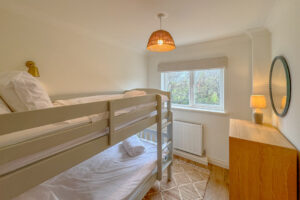 Ground floor bunk bed room at Aquataine Lodge