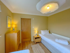 Ground floor twin bedroom at Aquataine Lodge