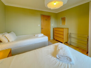 Ground floor twin bedroom at Aquataine Lodge