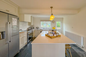 Fully equipped kitchen at Aquataine Lodge with island and back door