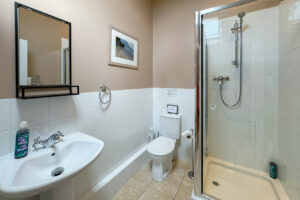 Master ensuite shower room with toilet and wash hand basin and toilet at Penjerrick