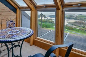 Views of the beach from windows in first floor bedroom at Morvoren