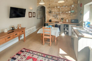 Well equipped kitchen and dining area at Pensile House Cottage
