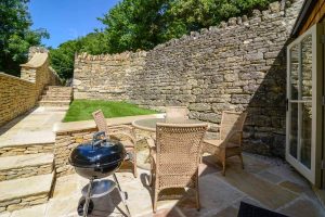 BBQ and seating area at rear of Pensile House Cottage