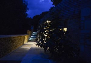 Side entrance to Pensile House Cottage at night time