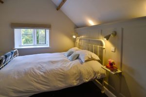 King sized bedroom on the first floor at Pensile House Cottage