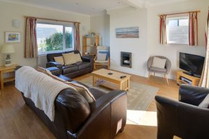 Lounge area at Parc Vean with seating and TV