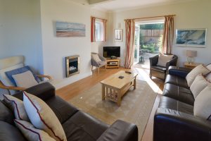 Lounge area at Parc Vean with double doors out to the rear patio area