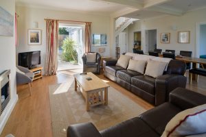 Lounge area at Parc Vean with double doors leading out on rear patio area