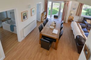Overhead picture of the dining area from the stairs at Parc Vean showing doors to the downstairs bathroom and the ground floor twin