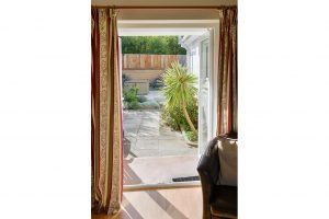 Double doors leading out to the rear patio area at Parc Vean
