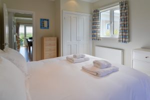 King bedroom on the ground floor at Parc Vean with door into the dining area