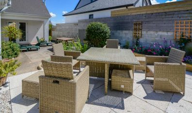 Patio area to the rear of Parc Vean with table and chairs