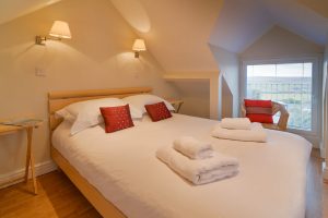 King bed in master ensuite bedroom at Parc Vean