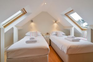 Twin bedroom on first floor at Parc Vean with 2 Velux windows