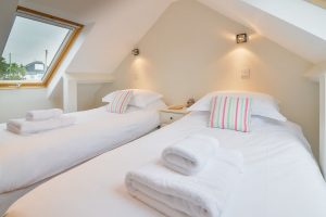 Twin bedroom on first floor at Parc Vean with Velux windows