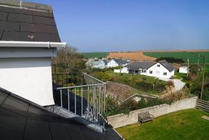 View over adjacent properties towards farmland from the first floor at Parc Vean