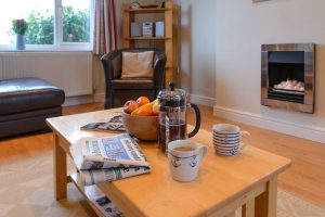 Coffee table in lounge with fire