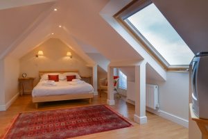 King bed in ensuite bedroom 1 at Parc Vean with Velux windows
