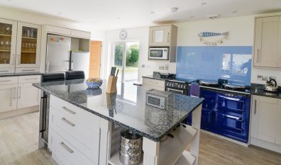 Well equipped kitchen with AGA and island at Pendoric