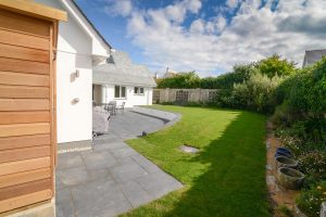 Grassed garden area and patio to the rear of Pendoric