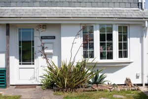 View of front of the house at Penjerrick with front door and window