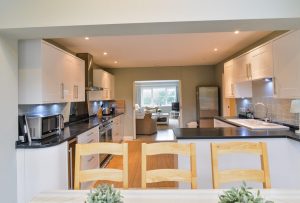 Views from dining area through to the kitchen and lounge at Penpor