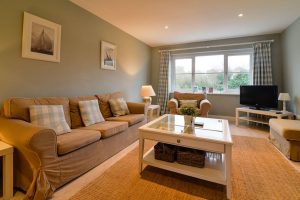 Ground floor lounge with TV at Penpor