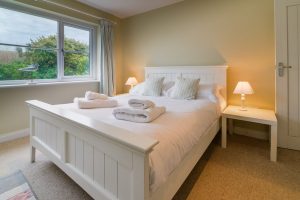 King sized bedroom on the ground floor at Penpor