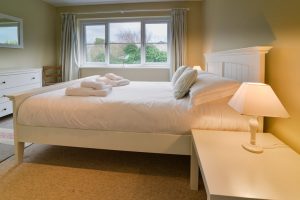 King sized bedroom on the ground floor at Penpor