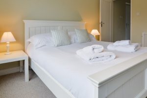 King sized bedroom on the ground floor at Penpor