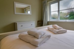 King sized bedroom on the ground floor at Penpor