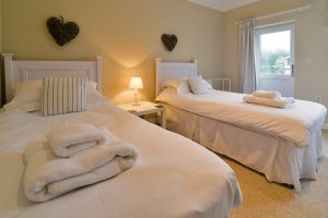 Twin bedroom on the ground floor at Penpor with external door