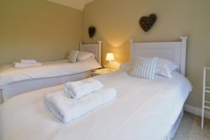 Twin bedroom on the ground floor at Penpor