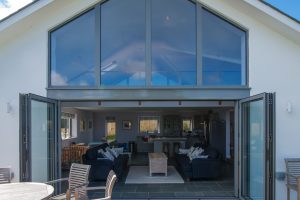 Views inside Ridgegrove from the garden through the bifold doors