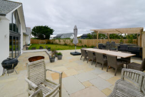 Patio area at Ridegrove with BBQ and grassed garden area